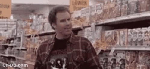 Man In Plaid Shirt At Grocery Store Shelf GIF