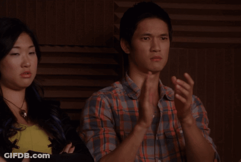 Man In Plaid Shirt Beside Woman In Yellow Shirt GIF