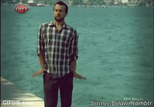 Man In Plaid Shirt By Water With TRT Logo GIF