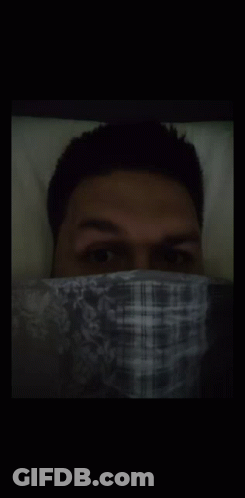 Man In Plaid Shirt Covering Face GIF