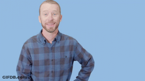 Man In Plaid Shirt Doing Call Me Gesture GIF