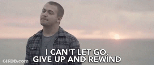 Man In Plaid Shirt Eyes Closed At Ocean GIF