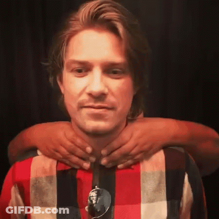 Man In Plaid Shirt Getting Neck Massage GIF