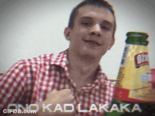 Man In Plaid Shirt Holding Bottle Of Ritz GIF