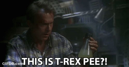 Man In Plaid Shirt Holding Bottle Says This Is T-Rex Pee GIF