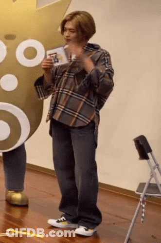 Man In Plaid Shirt Holding Card GIF