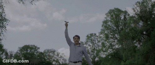 Man In Plaid Shirt Holding Lightning Bolt GIF