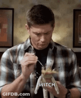 Man In Plaid Shirt Holding Stuffed Animal GIF