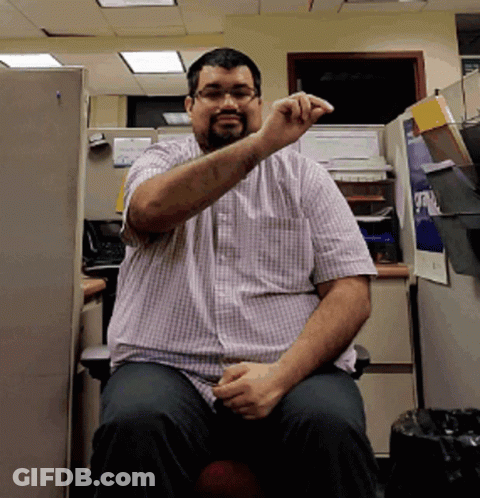 Man In Plaid Shirt In Cubicle Saying A GIF