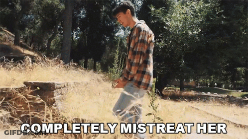Man In Plaid Shirt In Field Saying Completely Mistreat Her GIF