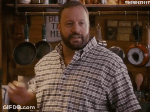 Man In Plaid Shirt In Front Of Block The Me Sign GIF