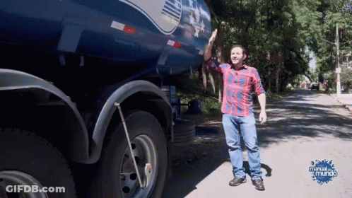 Man In Plaid Shirt In Front Of Blue Truck Manual Do Mundo GIF
