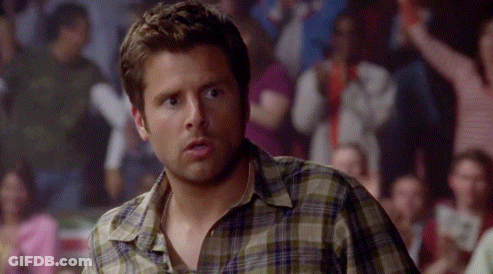 Man In Plaid Shirt In Front Of Crowd GIF