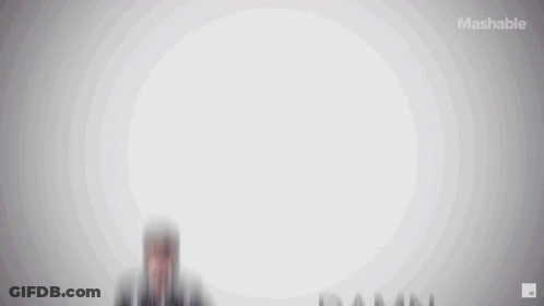 Man In Plaid Shirt In Front Of Mashable Ad GIF