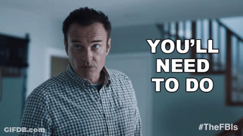 Man In Plaid Shirt In Front Of Sign Saying You'll Need To Do GIF