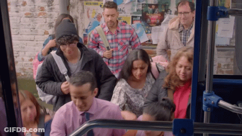 Man In Plaid Shirt In Front Of Work For Us Poster GIF