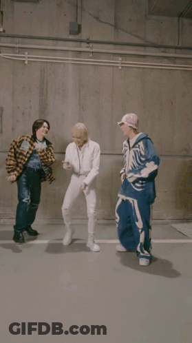 Man In Plaid Shirt Kicking Another Man GIF