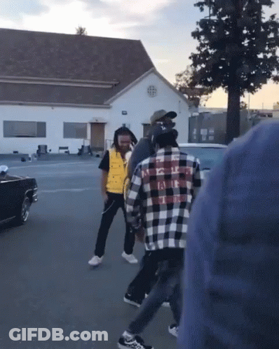 Man In Plaid Shirt Kicking Another Man GIF