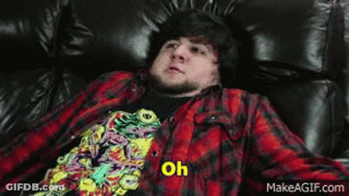 Man In Plaid Shirt Laying On Couch Says My Favourite GIF