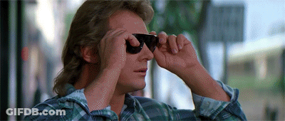 Man In Plaid Shirt Looking Through Sunglasses GIF