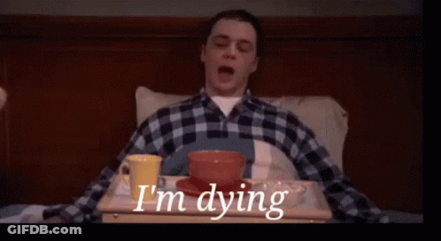 Man In Plaid Shirt Lying On Bed With Food GIF