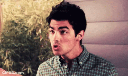 Man In Plaid Shirt Making A Face GIF