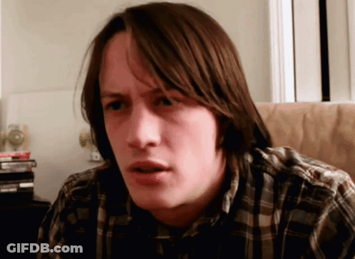 Man In Plaid Shirt Making A Face GIF