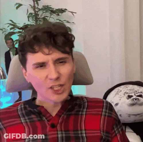 Man In Plaid Shirt Making A Face GIF