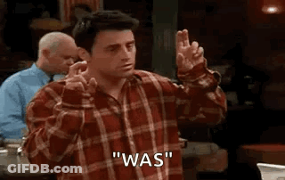 Man In Plaid Shirt Making Peace Sign GIF