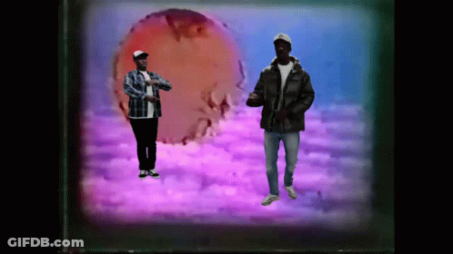 Man In Plaid Shirt Next To Man In Black Jacket GIF
