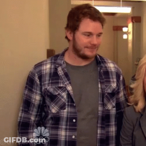 Man In Plaid Shirt Next To Woman GIF