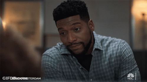 Man In Plaid Shirt On NBC Television GIF