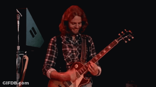 Man In Plaid Shirt Playing Guitar GIF