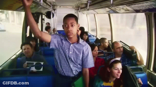 Man In Plaid Shirt Riding Bus GIF