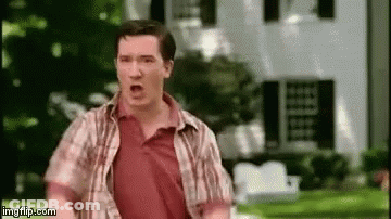 Man In Plaid Shirt Running In Front Of House GIF