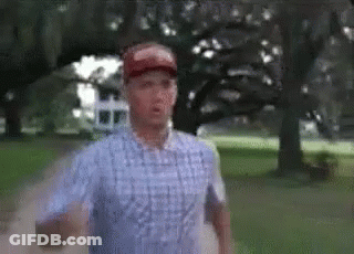 Man In Plaid Shirt Running In Park GIF