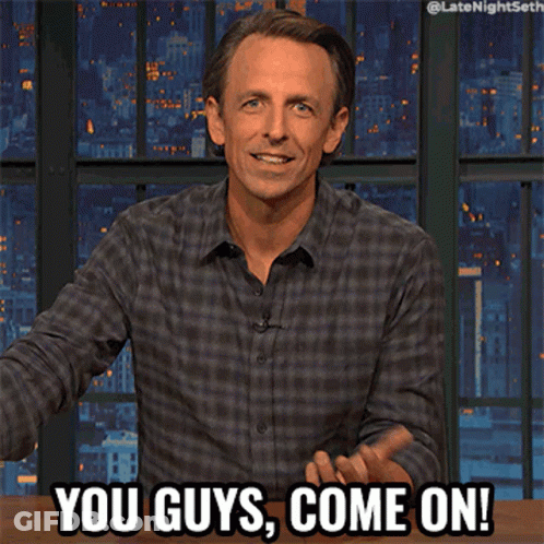 Man In Plaid Shirt Says You Guys Come On In Front Of City Skyline GIF