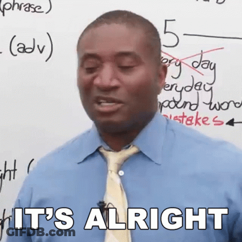 Man In Plaid Shirt Sitting At Desk GIF