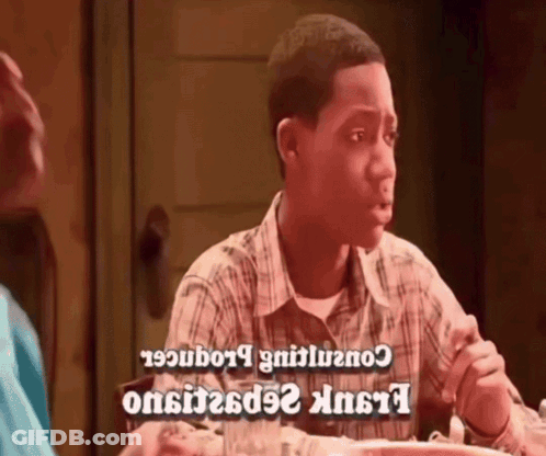 Man In Plaid Shirt Sitting At Table With Food GIF