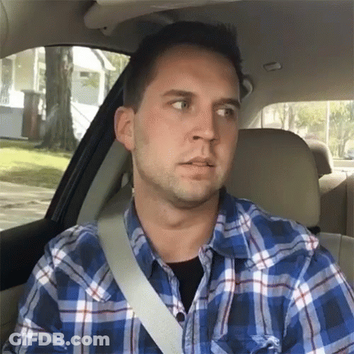 Man In Plaid Shirt Sitting In Car With Seat Belt GIF