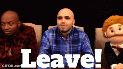 Man In Plaid Shirt Sitting Next To Puppet GIF