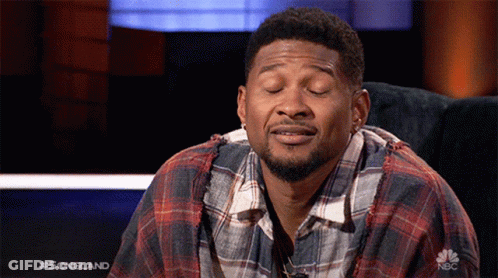 Man In Plaid Shirt Sitting On Couch Eyes Closed GIF