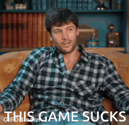 Man In Plaid Shirt Sitting On Couch Saying This Game Sucks GIF