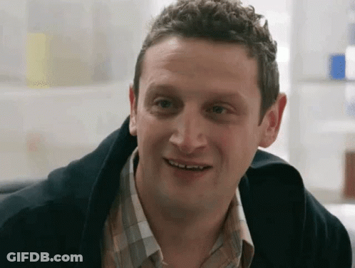 Man In Plaid Shirt Smiling At Camera GIF