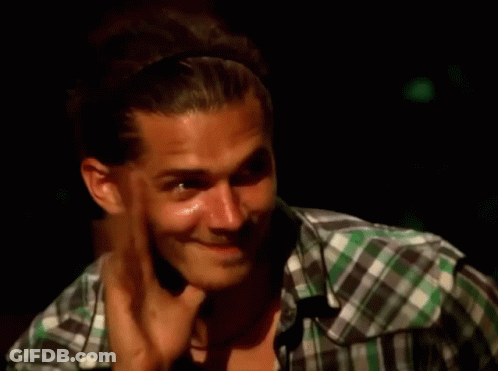 Man In Plaid Shirt Smiling Hand On Chin GIF