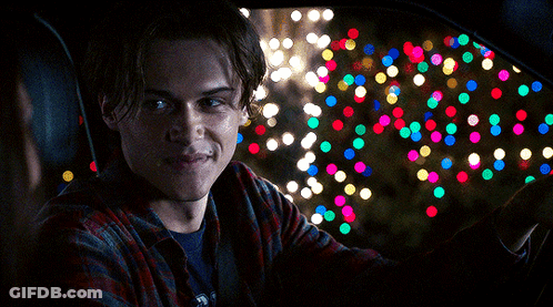 Man In Plaid Shirt Smiling In Car GIF