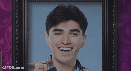 Man In Plaid Shirt Smiling In Frame GIF