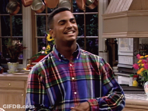 Man In Plaid Shirt Smiling In Kitchen GIF