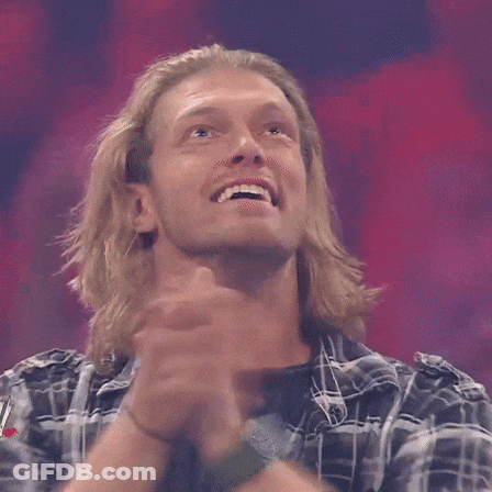 Man In Plaid Shirt Smiling With Arms In Air GIF