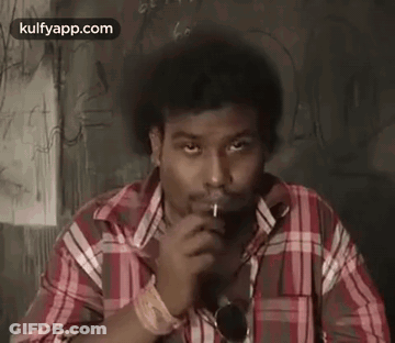 Man In Plaid Shirt Smoking Cigarette GIF